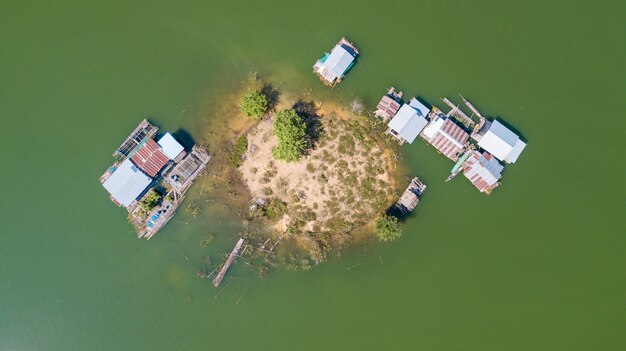 Aerial view of little island with boats