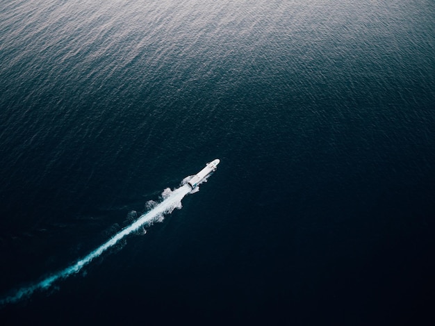 Aerial view of motorboat sailing in sea