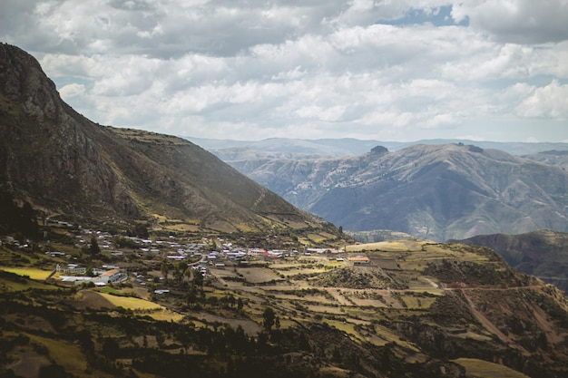 Aerial view of the mountains with a small town Ayacucho Peru