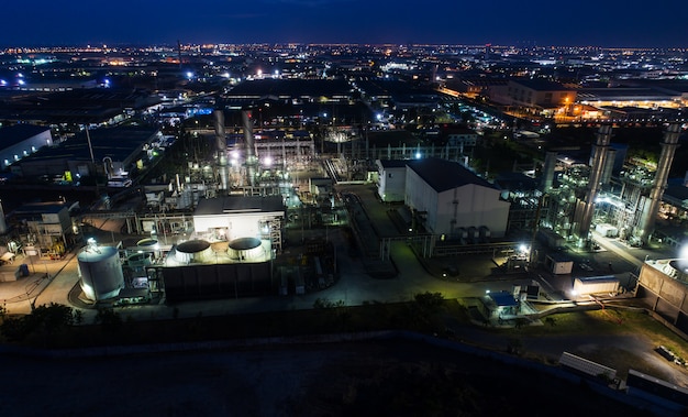 Aerial view night light oil terminal is industrial facility for storage of oil and petrochemical. 