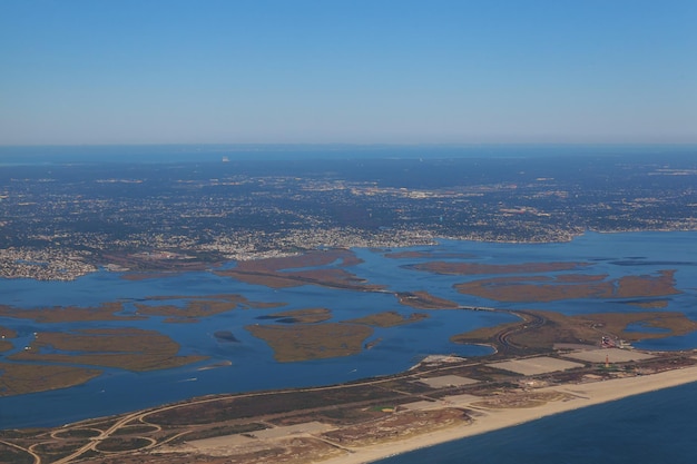 Aerial view of the ocean and also the coast from the altitude of the aircraft