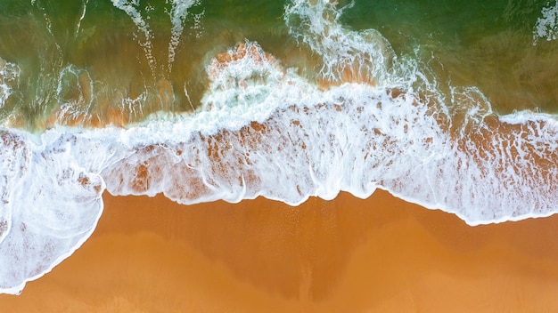 Aerial view ocean wave and sandy beach