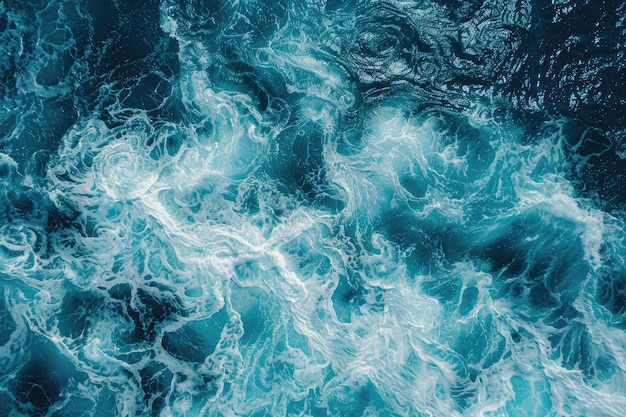 Aerial view of ocean waves on sunny day