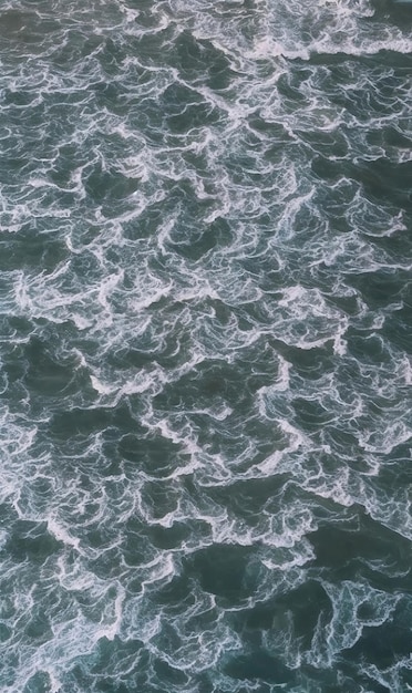 an aerial view of the ocean with waves Generative AI