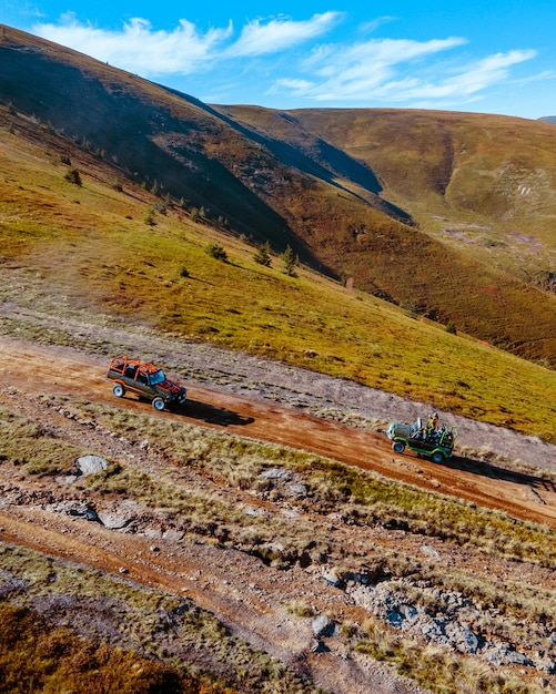 Aerial view of off road attraction road to the top of carpathian mountains