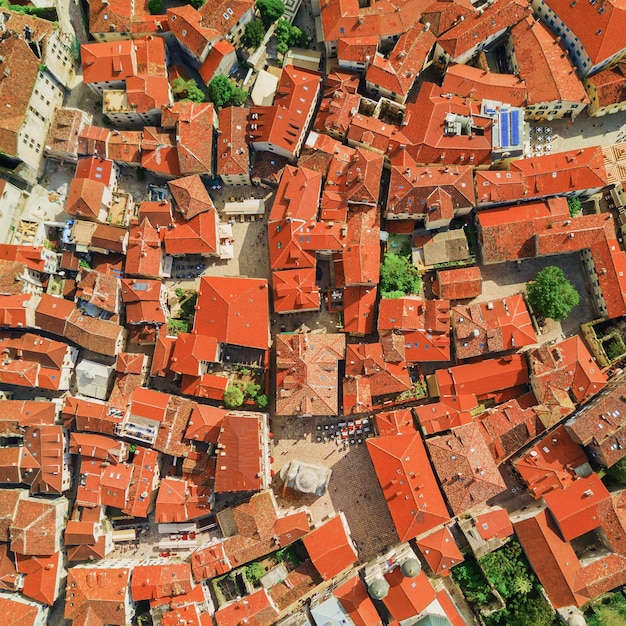 Aerial view of the old european city with red tiled roofs of houses