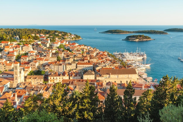 Aerial view of the old town of Hvar with turquoise water bay with yachts and islands in Dalmatia Croatia and Adriatic sea