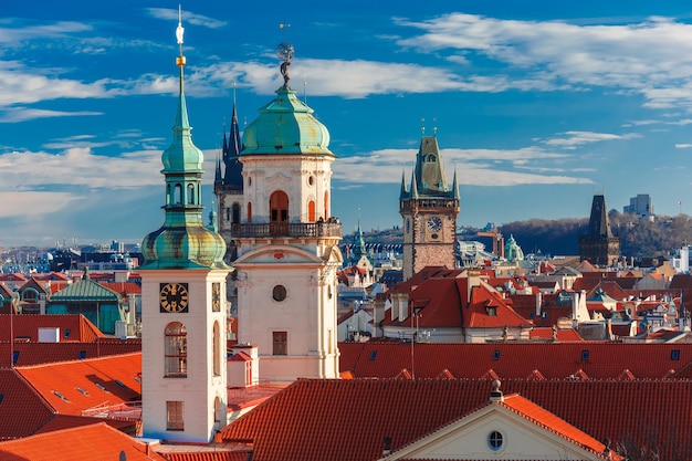 Aerial view over old town in prague with domes of churches bell tower of the old town hall powder to