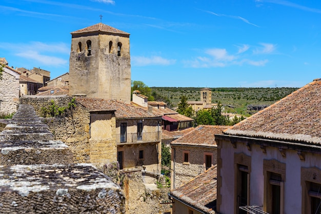 Aerial view of an old town with its Romanesque church and its stone wall