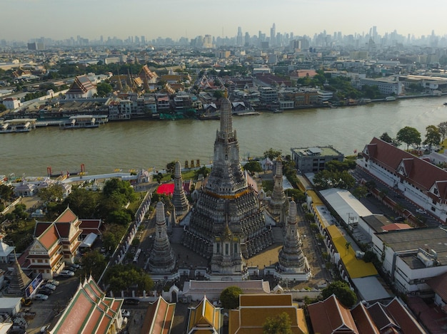 An aerial view of the Pagoda stands prominently at Wat Arun Temple with Chao Phraya River The most famous tourist attraction in Bangkok Thailand