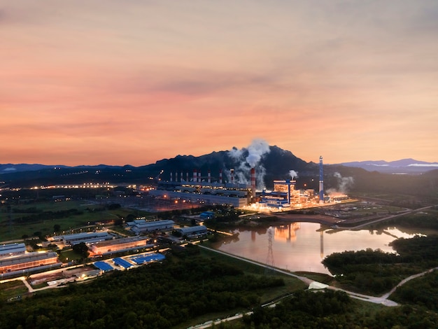 Aerial view, Panoramic view of coal-fired power plants in a large area The machine is working to generate electricity. Beautiful morning sunrise sky, Mae Moh, Lampang Province, Thailand.