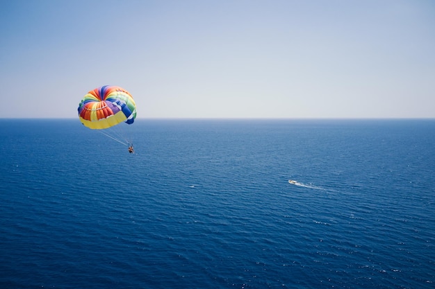 Aerial view of parasailing sky vacation sea entertainment