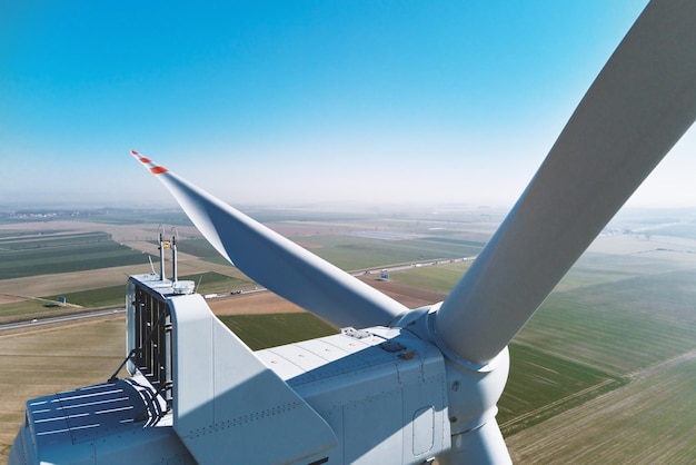 Aerial view of part of windmill turbine in countryside Green energy