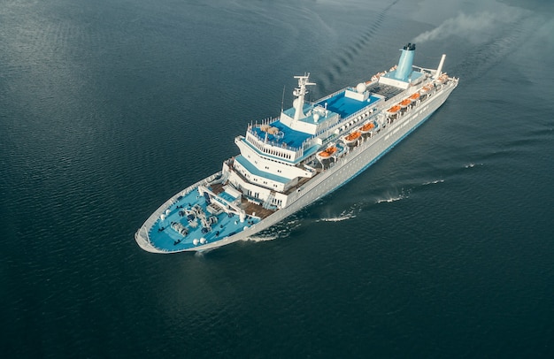 Aerial view of passenger ship floating in the open sea