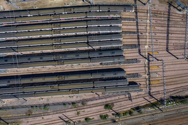 Aerial view over passenger trains in rows at a station