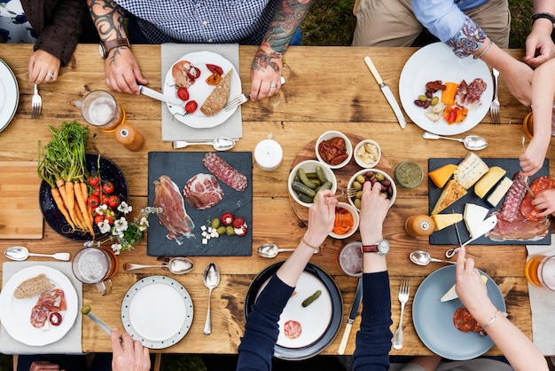 Aerial view of people having dinner in the backyard