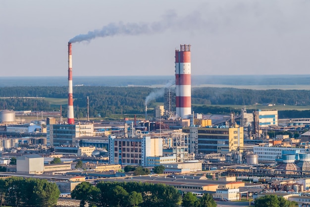 Aerial view on pipes of chemical enterprise plant Air pollution concept Industrial landscape environmental pollution waste of thermal power plant