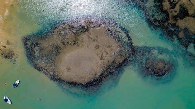 Aerial view of Praia do Espelho Porto Seguro Bahia Brazil Natural pools in the sea cliffs and greenish water