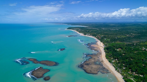 Aerial view of Praia do Espelho Porto Seguro Bahia Brazil Natural pools in the sea cliffs and greenish water