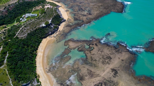 Aerial view of Praia do Espelho Porto Seguro Bahia Brazil Natural pools in the sea cliffs and greenish water