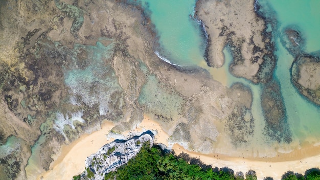 Aerial view of Praia do Espelho Porto Seguro Bahia Brazil Natural pools in the sea cliffs and greenish water