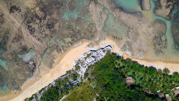 Aerial view of Praia do Espelho Porto Seguro Bahia Brazil Natural pools in the sea cliffs and greenish water