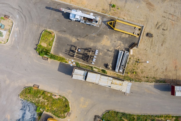 Aerial view preparation on construction site zone from above of building material