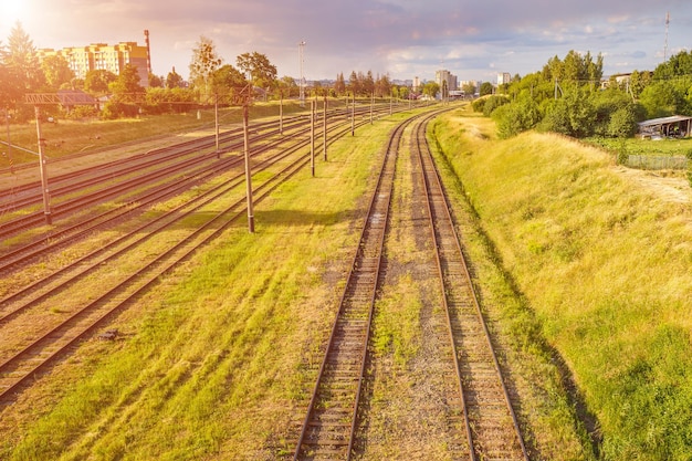 Aerial view on Railway tracks against beautiful sky at sunset Cargo shipping Travel background