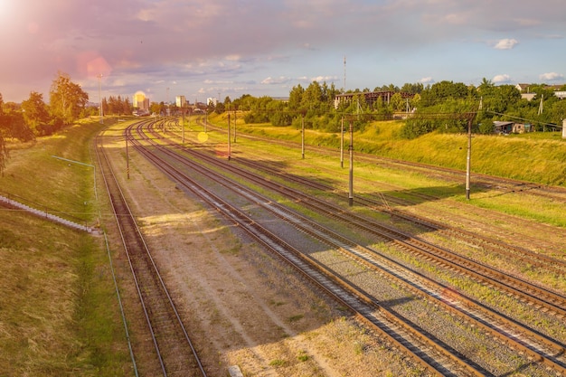 Aerial view on Railway tracks against beautiful sky at sunset Cargo shipping Travel background