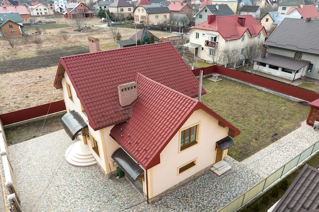 Aerial view of residential house with backyard in suburban rural area