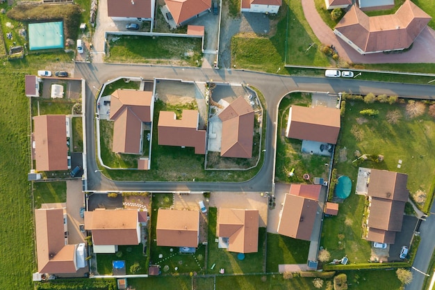 Aerial view of residential houses in green suburban rural area