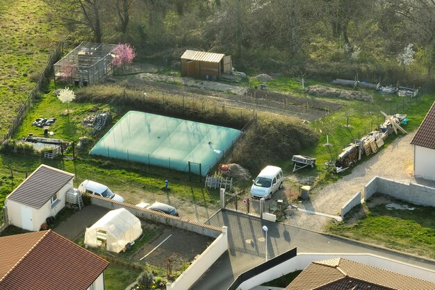 Aerial view of residential houses in green suburban rural area