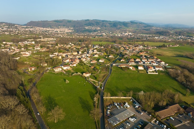 Aerial view of residential houses in green suburban rural area