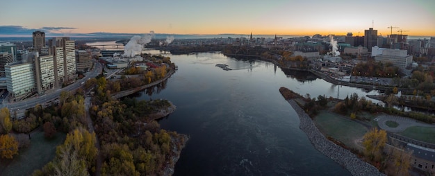 Aerial view of a river in between downtown Ottawa at sunrise