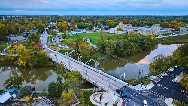 Aerial View of Riverside Town at Dusk with Veterans Memorial Bridge Fort Wayne