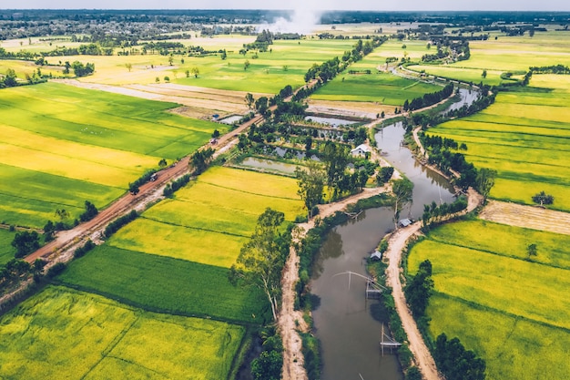 aerial view of road and devious river in a fields