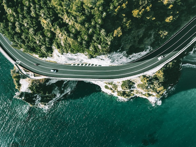 Aerial view of road going along ocean or sea in Italy