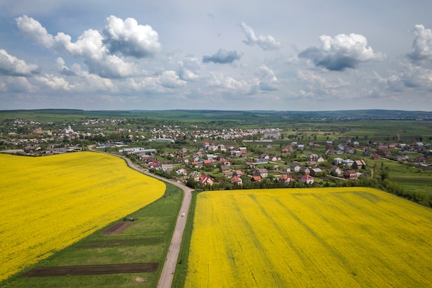 Aerial view of road in green fields