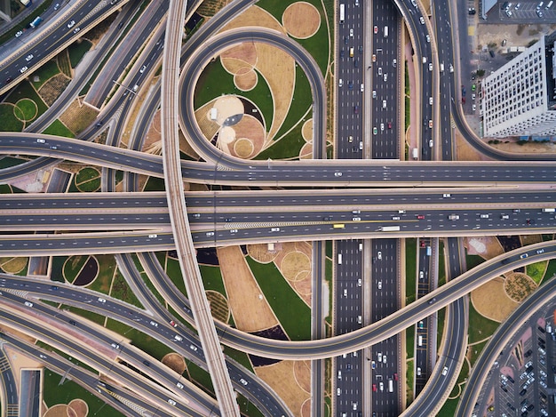 Aerial view of road junction with railway tracks in Dubai, UAE