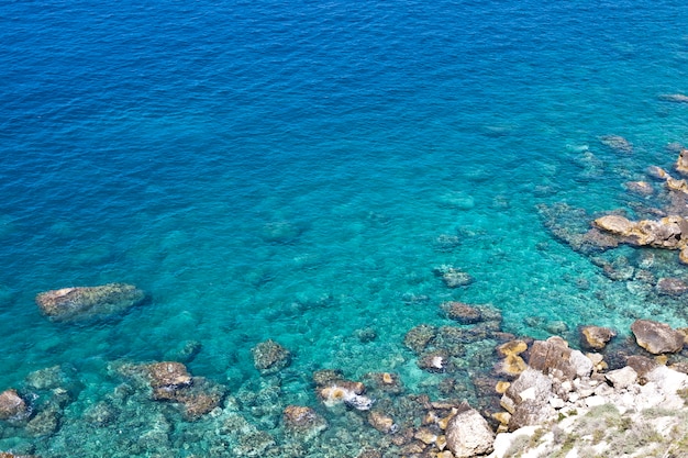 Aerial view of rocks on the sea. Overview of the seabed seen, top view