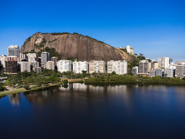 Aerial view of Rodrigo de Freitas Lagoon south zone of Rio de Janeiro Brazil In the background the beaches of Ipanema and Leblon Sunny day Cars traveling on Avenida Epitacio Pessoa Drone photo