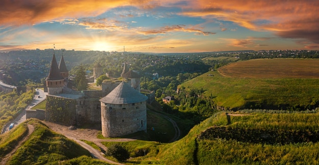 Aerial view of the romantic stone medievel castle on top of the mountain