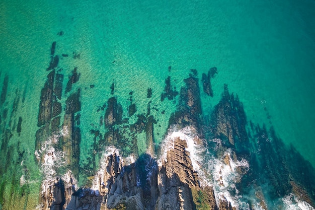 Aerial view of sea waves breaking on a fantastic rocky coast