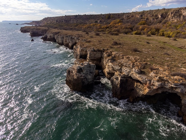 Aerial view of sea waves and fantastic cliffs rocky coast Kamen Bryag Yaylata reserve Bulgaria