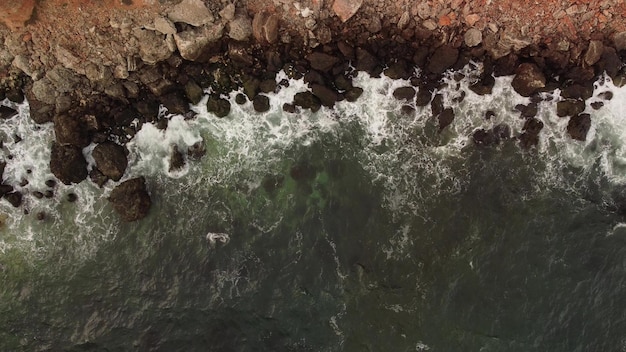 Aerial view of sea waves and fantastic cliffs rocky coast Tyulenovo Bulgaria