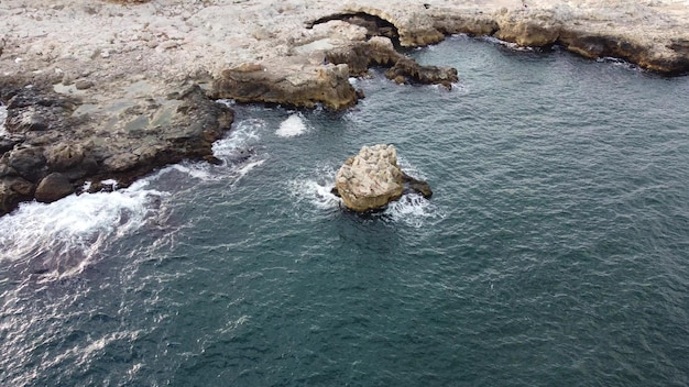 Aerial view of sea waves and fantastic cliffs rocky coast Tyulenovo Bulgaria