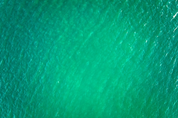 Aerial view of seascape surface of green sea water with small ripple waves