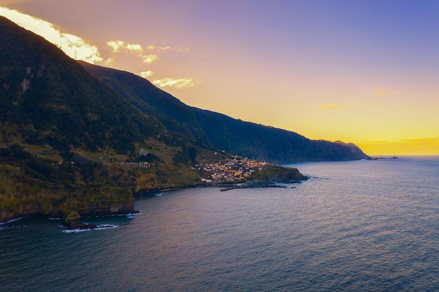 Aerial view of seixal beach village on madeira portugal at sunset