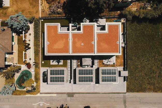 Aerial view of solar panels or solar cells on the roof of house Power plant renewable clean energy source Eco technology for electric power in industry