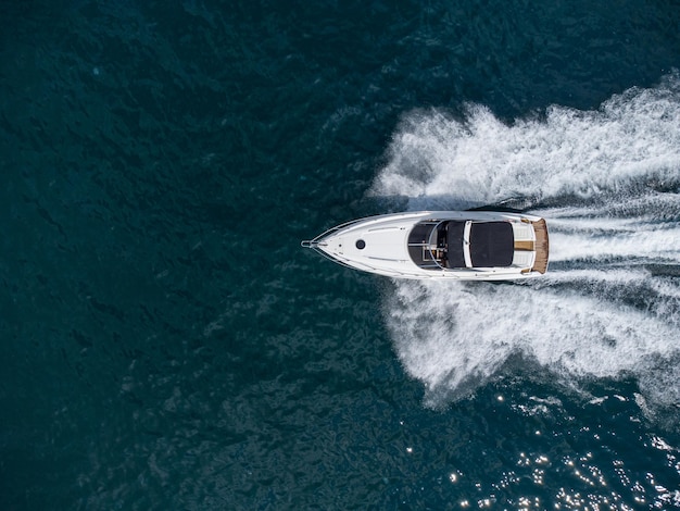 Aerial view of speed motor boat on open blue sea